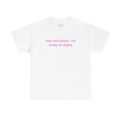 White t-shirt with pink text 'rise and shine, I'm ready to argue' on a white background