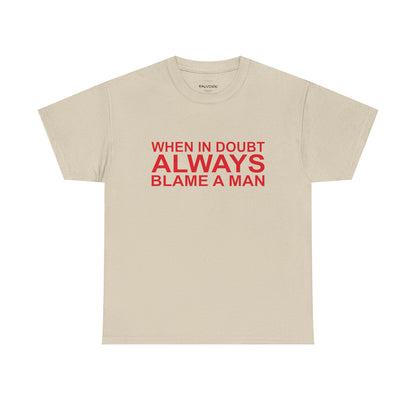 Beige t-shirt with red text 'WHEN IN DOUBT ALWAYS BLAME A MAN' on a white background