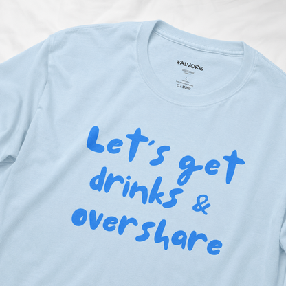 Light blue t-shirt with blue text 'Let's get drinks & overshare' on a white background